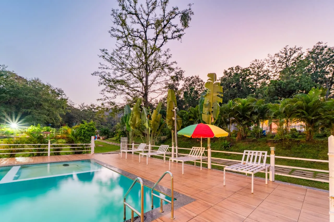 Green grounds and recreation area at Jungle Cottage & Group Stay
